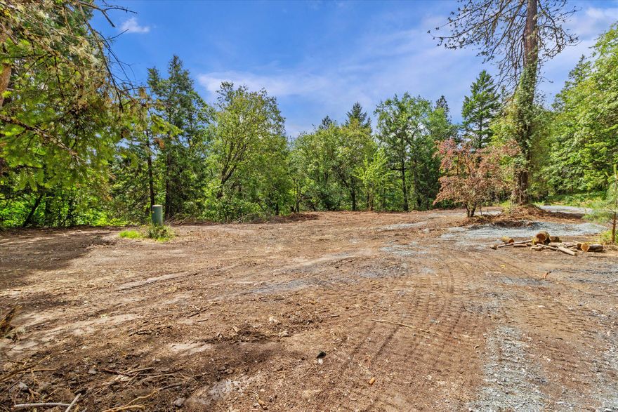***5/15 UPDATE***: Access road from east has been created so you can drive to the homesite! Homesite has been cleared so you can see where your dream home will land! APPOINTMENT ONLY, Please drive slow on access road. If you are looking for an amazing homesite for building, this could be the one. Gorgeous 5.4 acre parcel with mature native trees is ready for a new home.   The well and septic are on site, and power utilties are there too. Buyer to do due diligence but possible river views with clearing of trees. Just a few minutes from town, this location is peaceful, and offers sense of privacy. Absolutely stunning setting, a must see. Four hour well flow performed 11-2-23 was 1 GPM and with holding tank installed will support household. If building a bigger home, Siskiyou Drilling can install new well, buyer to do due diligence. Tammy Morgan with Rogue Credit Union can provide land financing to qualified buyer with 15% down! Listing agent is related to seller.