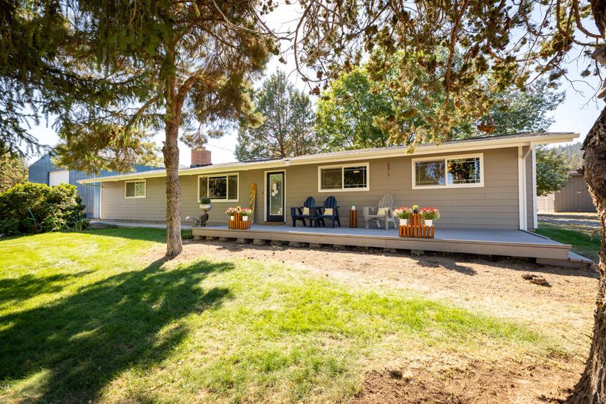 Beautiful setting in the trees with privacy and mountain views. Solid home built in 1961, recently remodeled, featuring 4 bedrooms, 1 &1/2 baths, Living room with fireplace, & large TV/Rec room for entertaining. Many upgrades including vinyl windows, new paint, roof and gutters, new flooring, new lights,  6 new ductless Mitsubishi units for heat & A/C. Dream kitchen with wood cabinets, garden window, solid surface counters and all appliances. On approx.18 + acres, fenced and cross fenced,  3 stall barn with power, water & tack room,  corrals, pole barn for hay storage, new 36X36 METAL SHOP with 14' door. Cool & shady back yard, with deck, 4 raised garden beds, above ground pool & hot tub on the new patio. Private yet close to town.