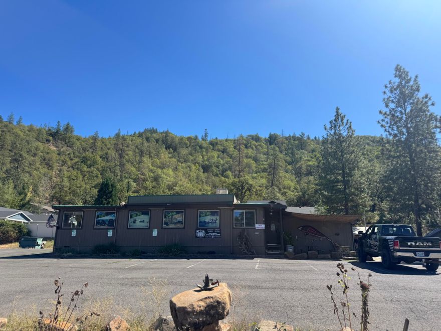 Prime commercial opportunity in the heart of Shady Cove! Hard to find, this nearly 1,600 sq. ft. renovated building offers flexible office space, a fully equipped commercial kitchen, bathroom, and sits on a generous .83-acre lot with abundant parking. Located on a high-traffic stretch with excellent highway visibility, this property is ideal for a wide variety of ventures. Current approved uses include restaurant and outdoor recreation business, with GC zoning providing endless possibilities—check with the City of Shady Cove for additional options. Whether you're searching to establish a new business or expand an existing one, this property's location and layout make it a rare find. Appointment only. Priced to sell immediately—don't miss out on this excellent investment opportunity!