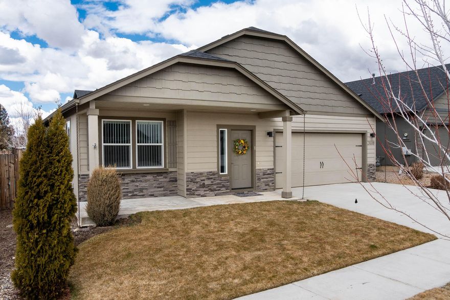 Fabulous single level with over $60,000 in upgrades!  This home was used as the model for the subdivision & is one of the nicest homes in the neighborhood!  Upgrades include covered & extended patio area in private & fenced backyard, A/C, solid surface countertops, full tile backsplash, self-close cabinets/drawers, wood wrapped windows, HW floors, GE SS appliances, exterior stone accents & more! Open floor plan with a GR gas FP, covered patios in both front & back of home. new interior paint & new carpet.  Spacious master BR with adjoining bath, soaker tub, stall shower & dual vanities.  The kitchen has abundant cabinetry with pantry & eating bar as well as direct access to the covered patio. Must see to appreciate!  Well established Northeast Bend neighborhood blocks away from Eagle Park which offers a playground & picnic areas with Cascade Mtn views. Pine Nursery Park, just minutes away, offers 159 acres of expansive green space, dog parks & trails, plus athletic fields & courts.