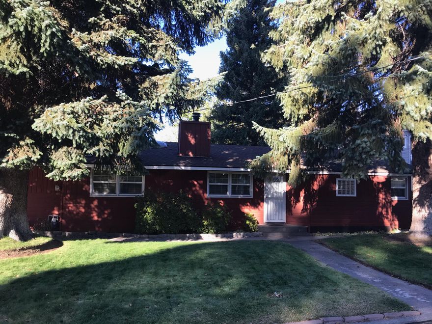 Mid town charmer. Central location with a spacious backyard. 1950's single level home on a double lot - .25 acres. Hardwood floors with a cozy fireplace. Country kitchen bursting with vintage charm. Bonus room leads to a backyard which includes a covered deck, private shed, and large yard with mature trees. The single garage attaches to a carport which provides a convenient entry into the kitchen. Don't miss this gem, it won't last long!