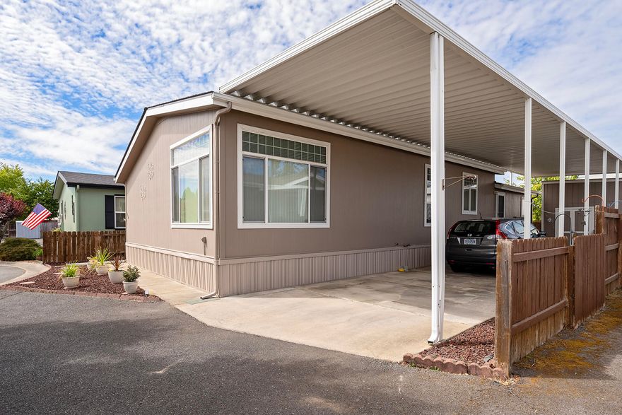 Immaculate 3 bedroom 2 bath in Redwood Acres 55+ park! This home offers tons of natural light with an open concept, vaulted ceilings, two living spaces, primary bedroom with walk-in closet and en suite bath, 2 generous sized guest bedrooms, and more! Low maintenance living at its finest! Unbelievably low space rent (only $475!) NEW roof in 2024.