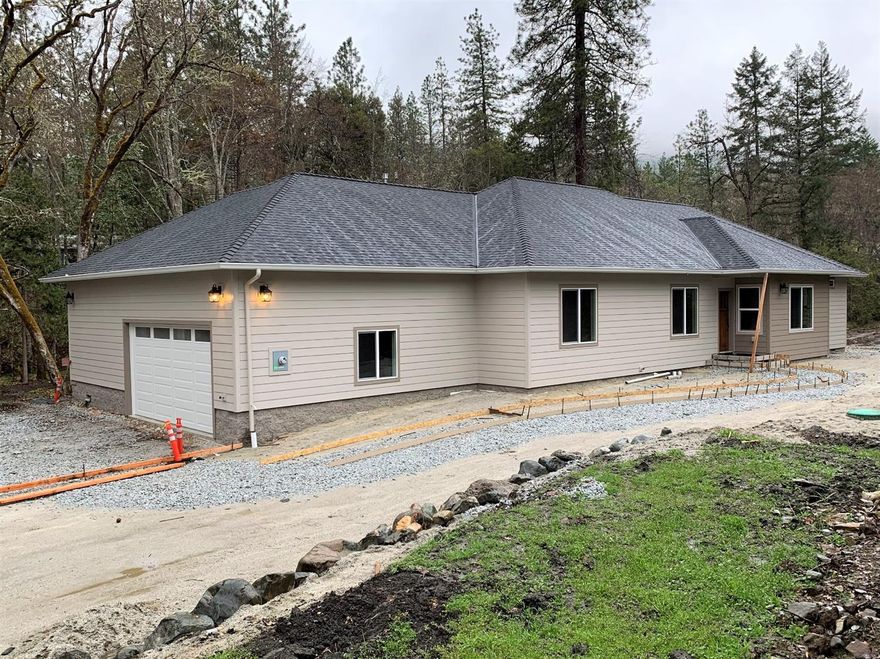 Absolutely gorgeous new high end home on Louse Creek in Colonial Valley scheduled to be finaled in April. Granite counters, farm style cabinets and kitchen sink, Jenn-aire 6 burner gas stove with gas oven, Jenn-aire dishwasher and microwave, canned lights in 9'ceilings, ceiling fan(s), over 800'of insulated finished garage with double sized gar door, covered trex deck with overhead canned lighting. And kitchen, dining, master, and laundry room overlooking year round Louse Creek. Twin walk-in master closets, carpeted bedrooms, tiled bathroom and laundry floors. Huge stamped concrete parking apron & walkways, stamped concrete patio plus covered deck overlooking creek. So country, yet such an easy drive to town! All information deemed to be accurate but not verified; anyone considering purchasing this property should perform their own investigation into the uses and condition of the property.