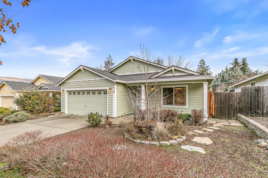 Newer single-level home on a spacious 0.17-acre lot located near groceries, schools, and public parks! High vaulted ceilings and solid Hickory hardwood flooring throughout living areas. Kitchen with under-cabinet lighting, island with dining counter and stainless steel double sink, range oven, microwave hood, dishwasher, and refrigerator. Open dining and living room with sliding glass door to pebbled concrete patio and fully fenced backyard with sunny gardening areas. Primary bedroom with new carpet, walk-in closet, and full ensuite bathroom with double vanity. Two guest bedrooms with closets, and full guest bathroom with tub shower. Recent improvements include all-new bedroom carpets, fresh interior touch-up painting, new shower surrounds, new toilets, and new waterproof vinyl plank flooring in each bathroom. Laundry room with LG washer and dryer included, plus a two-car garage with built-in storage shelving. Inquire for details!