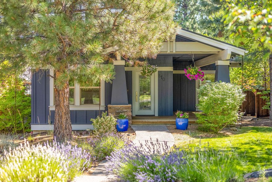 Set back on a quiet street, this thoughtfully designed Craftsman home on an oversize lot captures the best of Bend living. The light-filled great room with an updated kitchen flows seamlessly for entertaining. The main level offers a flexible den/office//bonus space and a convenient laundry/mudroom with ample storage. Upstairs are 4 bright bedrooms and 2 full baths, including a spacious primary suite with an updated bathroom. The property shines with extras: an attached 2-car garage with EV charger and storage, plus a rare detached oversized 1-car garage—ideal for gear, a home gym, or ADU potential. Behind is discreet parking for a boat, trailer or adventure van. The private backyard feels like a perfect year-round retreat with patio, turf, hot tub, and mature trees. Enjoy the coveted Northwest Crossing lifestyle—steps to Compass Park, 2 blocks to High Lakes Elementary, close to the farmers market, shops, restaurants and trails. A perfect base for everything that makes Bend special!