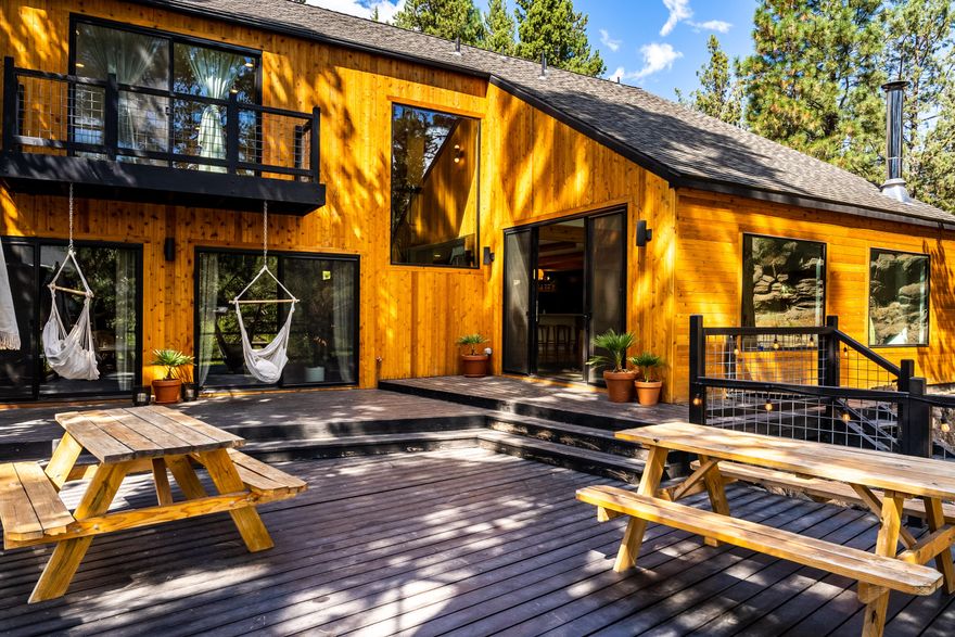 This stunning fully renovated Mid Century Modern home is perched on the banks of the Deschutes River
in Bend City limits! 2,625 Square Feet of completely updated space provide a true showcase and
entertaining home. Modern and urban design features highlight the architectural chic of the property,
in an updated and current floorplan featuring vaulted ceilings, open concept living and entertaining,
and truly breathtaking views of the River. Luxurious Kitchen is highlighted by a custom oversized
concrete surfaced island. Large Office/Bonus Room allows a private workspace. Great Room features
natural light and is wrapped with windows that bring the Deschutes River to you. Primary Suite is
luxurious and warm, with a spa like bathroom. 2nd and 3rd bedrooms have their own bathrooms. Large
deck overlooks the river, as does an upstairs deck off the Primary Suite.