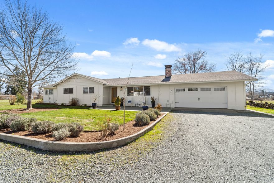 Wonderful opportunity to live the farm life on 5.25 irrigated acres close to town. This 1957 square foot 3 bdrm, 2 bath home has been lovingly updated with a modern farmhouse kitchen, large pantry, wood burning fireplace, french oak wide plank wood floors, new HVAC system in 2023, & lots of windows to enjoy the serene mountain & pasture views. Bonus great room could be used as a game room/office/movie room. Outside you'll enjoy lovely landscaping with in-ground sprinklers, large raised garden beds, and an above ground pool. Property is gated & fenced on 3 sides, & offers flat useable land. Hobby shop with garage door. Rustic hay barn with two lean-to style stalls. Large chicken coop w/a fenced chicken yard for all your feathered friends. 12 x 12 lean-to style pasture shelter. Property is flood irrigated & the soil is excellent. All this in a lovely neighborhood in district 7 schools. If you're looking for room to spread out and space for your animals, this is your new home!