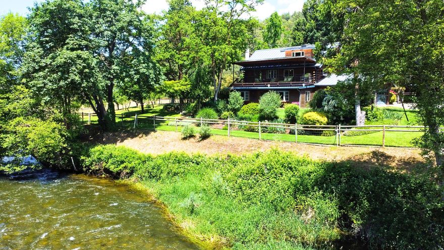 Welcome to this one-of-a-kind riverfront retreat, a haven for outdoor enthusiasts, boasting complete privacy and unspoiled river views. The property houses a main residence and a 540sqft guesthouse, complete with cutting-edge amenities like integrated Wi-Fi, fiber optics, heated floors, an automated backup generator, and a 700-bottle wine cellar. Water system is upgraded and includes filtration and softening, ensuring water quality.  Step outside to lush, irrigated organic landscaping, a mature orchard with a bounty of fruits, and raised gardens with automated watering. A field, ready for a barn or greenhouse, comes with electricity and water access. Solar power with automated tracking, private river access, and a unique swimming hole complete this paradise. This secluded property promises you complete privacy, perfect for hunting or simply enjoying peaceful moments amidst sunrises, sunsets and all the beauty that nature has to offer.