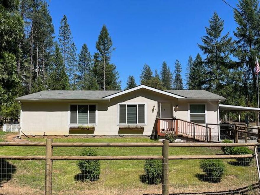 Nestled off the road is this park like setting on 2.53 level acres. Built in 2004 is this lovingly cared for home featuring 3 bedrooms, 2 baths and open floorplan. Well appointed kitchen with eating bar, granite counters, plenty of cabinetry, propane gas cooking stove, breakfast nook and dining area.  Light and bright living space with wood laminate flooring throughout. Recently painted inside, newer water heater, refrigerator, light fixtures, garbage disposal and dishwasher. All kitchen appliances included along with washer/dryer, outdoor above ground pool, gazebo and freezer. Propane also runs the heating and dryer. Attached carport, fire pit, 12x16 workshop, 10x10 metal shed with power and 20x12 pole barn outside ideal for storage and projects. Other features include pear and apple trees, full RV hookups, completely fenced and gated. This home is on a permanent foundation.  Country living but close to city services. VA ASSUMABLE loan at 2.25%.