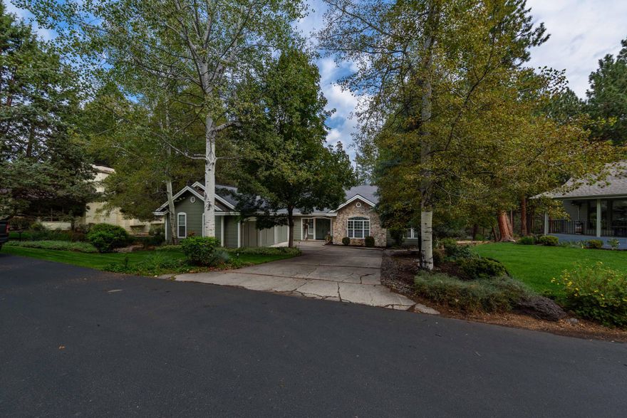 Located in a serene gated FIRE WISE community, this exquisite 3/4-bedroom, 4-bathroom home boasts 3035 sq. ft. of luxurious living space, plus a spacious den/office/flex area. (could be 4th bedroom) Recent upgrades include a new A/C, furnace, and water heater, as well as rain gutter guards for added peace of mind. The gourmet kitchen features a Wolf range and Ventahood, while new window coverings add a modern touch throughout. The primary suite includes a separate flex space, cozy fireplace, radiant heat in the bath, and a walk-in closet. Relax in the ultra-thermo-masseur hydro-massage tub or enjoy the expansive multi-level rear deck, perfect for outdoor entertaining. Vaulted ceilings, crown moldings, and skylights enhance the home's bright, airy feel. With an attached 3-car garage, built-ins, and ample storage, this home offers both luxury and functionality. Community amenities include a pool, pickleball & tennis courts, and snow removal. A true gem—like living in a park!  A must see