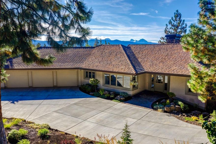 This inviting residence offers stunning views of the Cascade Mountains in the highly desirable Awbrey Butte neighborhood. Recent remodeling highlights include, hardwood floors, ensuite main level master & guest suites with walk-in closets & full bath, a recently installed heated driveway, a freshly updated kitchen & sitting area that is flooded with natural light, motorized awnings which permit all-weather outside dining and relaxation. The spacious master suite, located on the main level, provides private access to a spa-ready deck floating above the treetops with professionally landscaped grounds.