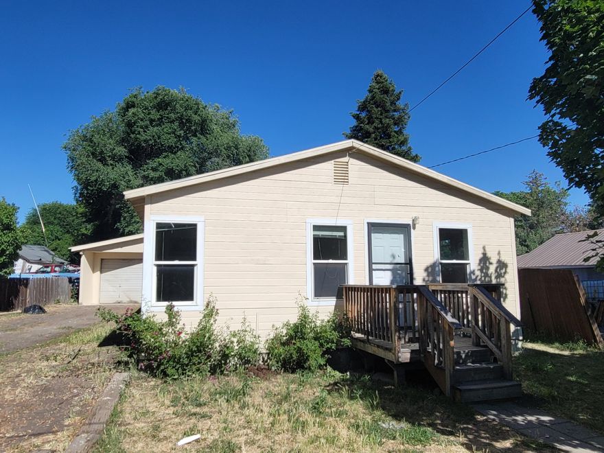 Charming home with new carpets and fresh paint. Home sits on a third of an acre with a large attached garage. Home has access from Lodi or Madison st. Large concrete
pad in back offers plenty of parking or possibility of adding a building for your business or personal use.