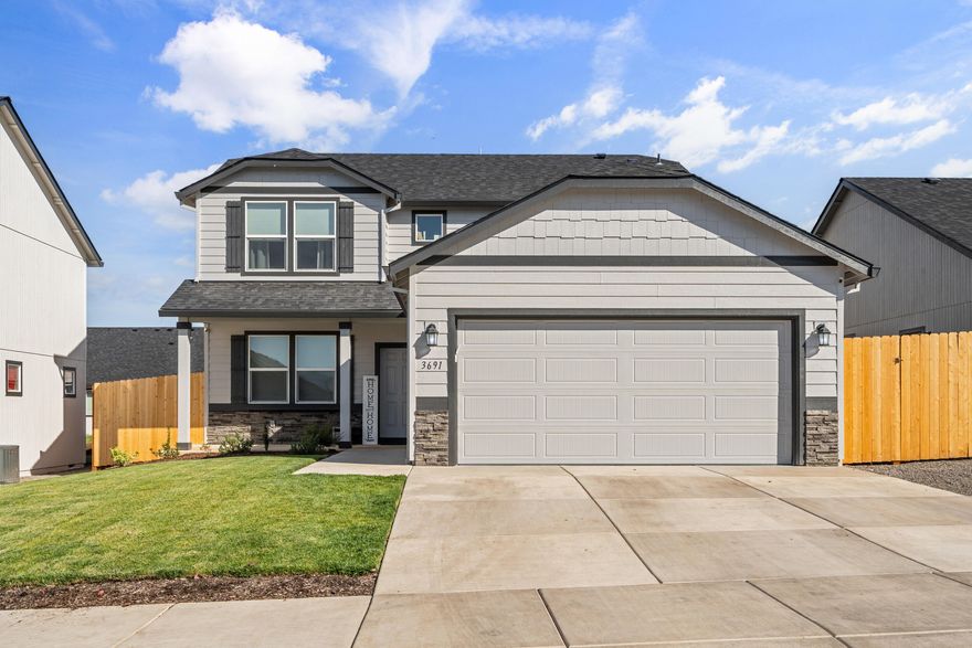 Beautifully designed and recently built, this 2,026 sq. ft. home sits in a safe, desirable Medford neighborhood close to schools and parks. The open concept main floor features a spacious kitchen with a large island and new fridge, while upstairs you'll find a luxurious main suite with an oversized closet, soaking tub, and dual vanity. The backyard is a true highlight, complete with new fencing, a new play structure for the kids, and plenty of room to enjoy outdoor living.