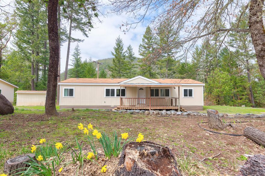 Looking for a peaceful retreat? Look no further than this house nestled on 16.28 acres of land, offering a quiet & very private setting. This all-electric home features 1400 square feet of living space, complete with an extra large, 2 car, 30 x 24 garage with a workshop area - perfect for any DIY enthusiast. Built in 1996, the house has double pane vinyl windows, laminate countertops, and ceiling fans in the dining area and master bedroom. The guest bath has been completely remodeled and the house features all new flooring throughout, making it move-in ready. You'll love the convenience of the laundry in the kitchen area and the front porch, ideal for relaxing with your morning coffee. The large well house offers a storage area and the property's Woodlot Resource zoning provides a range of possibilities. With all new exterior paint on all the buildings & a dishwasher and range included, this home is ready for you to make it yours. Water rights dated 1928. Don't miss out on this gem!