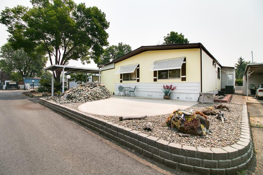 PRICED TO SELL! Newer roof (2014) Spacious, split floorplan for multigenerational (55+) living with master suite on one side and 2 beds and 1 full bath behind a door on the other. Living room and family room/den/office space. Remodeled, large kitchen with generous counter space. Need storage? Multiple storage spaces, including a one car garage/shop with loft storage; special locked parking for motorcycles, bikes and other toys; under porch storage for your holiday decorations; AND two garden sheds! No neighbors behind. Enclosed carport turns into private patio with the simple movement of a privacy screen. Low maintenance landscaping and fountain that turns on and off with the flip of a switch. All this AND a catio! Just a short distance to Costco, Natural Grocers, the mall and tons of restaurants. Park under new ownership, with new name and property upgrades. Come home to Rogue Valley Meadows today!