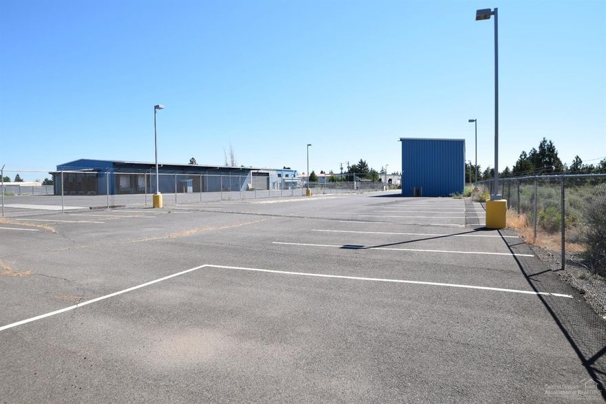 Former FedEx building for sale. Built in 1990, this Light Industrial zoned property resides on 2.51 acres. There is excess land that could accommodate approximately 20,000 SF of additional building space. The interior is comprised of 1,960 +/- SF of office space and 13,020 +/- SF of manufacturing/warehouse space. Building has multiple overhead doors. Property has extensive parking with large paved, gated, fenced & lighted yard and a 120' x 30' x 20' high storage shed. Note: Seller must close in 2017.