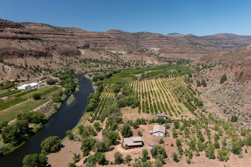 Riverfront paradise on the stunning North Fork of the John Day River! This charming 2-story chalet home sits on 11 acres with river views from a wrap-around front porch. Originally part of historic Thomas Orchard, the property still holds water rights from the river. Ideal for restoring an orchard, vineyard, or garden. 36x48 ft shop wired for 3-phase power also has a 1 bed / 1 bath bunkhouse and commercial use approved. 96 sq ft riverside shed with power and water—perfect for a potential studio, retreat, or gear storage. Fenced perimeter and ample space for gardening, animals, or hobby farming. Whether you're into fishing, hiking, rafting, or simply relaxing by the water, this unique property offers endless outdoor recreation right out your front door. Don't miss this rare opportunity to own a riverfront retreat in the heart of rural Oregon!
