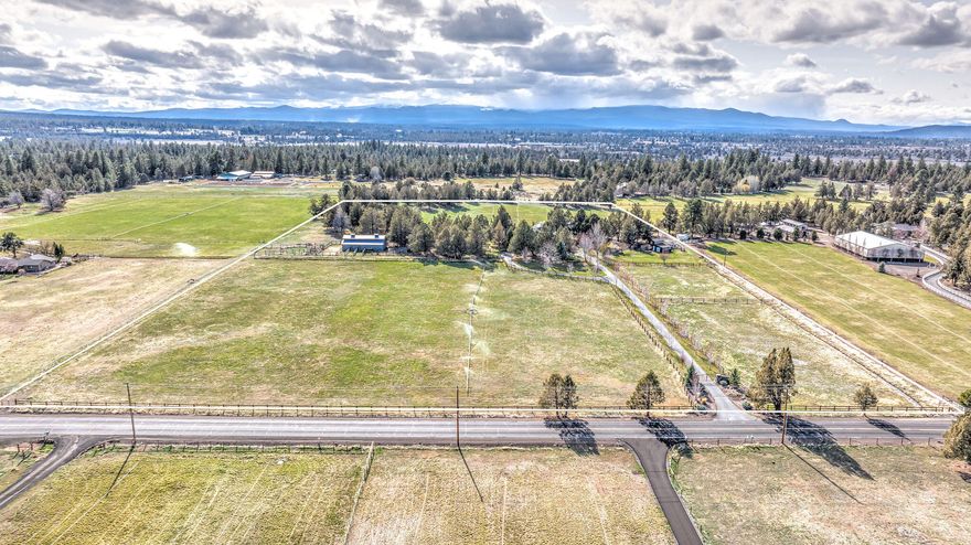 Located in a beautiful country setting, behind an amazing, gated entrance for extra privacy and security. This property is the perfect balance of town and country. This small acreage property has everything you could want, including a nice 3,889± square foot home. The custom home features 4 bedrooms, 3 bathrooms, two living spaces, an office, bonus room that could be another bedroom, office, or home gym, and a large three car garage. High end finishes are noted throughout the home including granite countertops, alder cabinetry, oak wood floors, and stone masonry. This property also includes a 3-stall barn with turnouts, a tack room, wash rack, office, and plenty of hay storage. Additional improvements include a hobby/studio building with several potential uses, three fully fenced pastures, chicken coop, and large pond. With 17 acres of irrigation through Arnold Irrigation District, this is the perfect set-up for horses, cattle, sheep, goats, or other livestock.