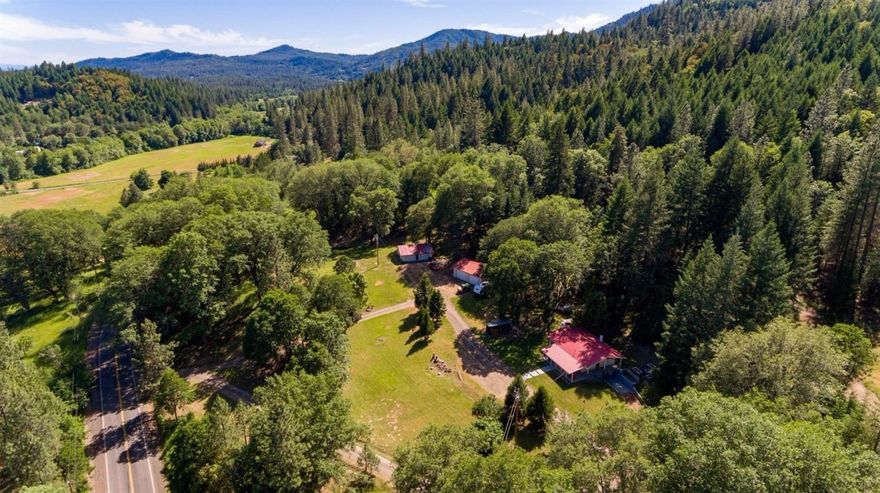 The perfect Southern Oregon Retreat! This is a beautiful 11.48 acre property, zoned EFU, with gorgeous views, and a charming home. The four bedroom, 2 bath home has been fully updated with new flooring, new interior paint, all new light fixtures, vinyl windows, and new kitchen tile backsplash and kitchen cabinets. There is a large detached garage, plus detached shop. The newer 2000 gal holding tank was installed in 2013, and there is a cross fences horse pasture. It is secluded and peaceful, with room for your animals or a hobby farm. A one of a kind property!