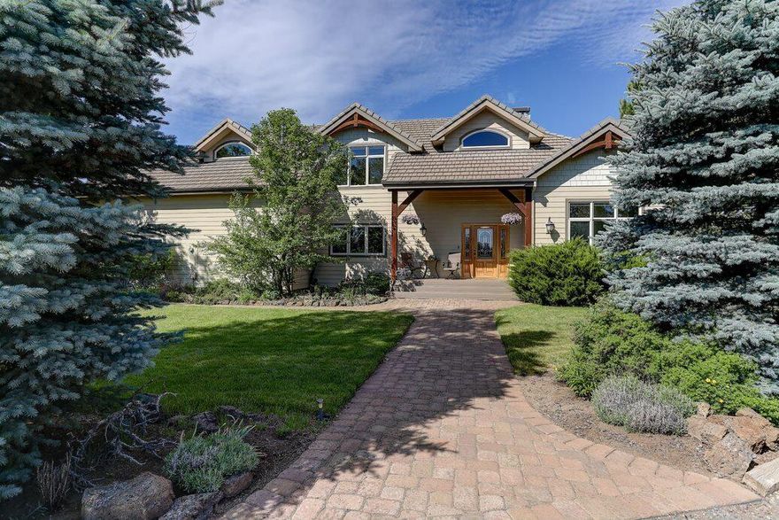 Rare Timber Frame home with incredible beams and joinery.  Cascade views, 10 acres fenced with room for horses.  Paved private road and driveway.  3205 sq ft house with 2 primary suites (one on main) and large 3rd bedroom all with walk-in closets.  Open loft has built in office. Great room has wow views and Extraordinaire fireplace in river rock surround.  Tile floors to maximize radiant heat. 3 car garage plus separate exercise/workroom.  Huge media room/den. Oversized laundry with sink and pantry.  Shop for RV and toys, greenhouse and fenced garden.  Back gate leads to BLM.  3 decks (2 covered) plus hot tub.  1 mile to Hwy 20, 5 to 126.  Sought after Sisters schools.