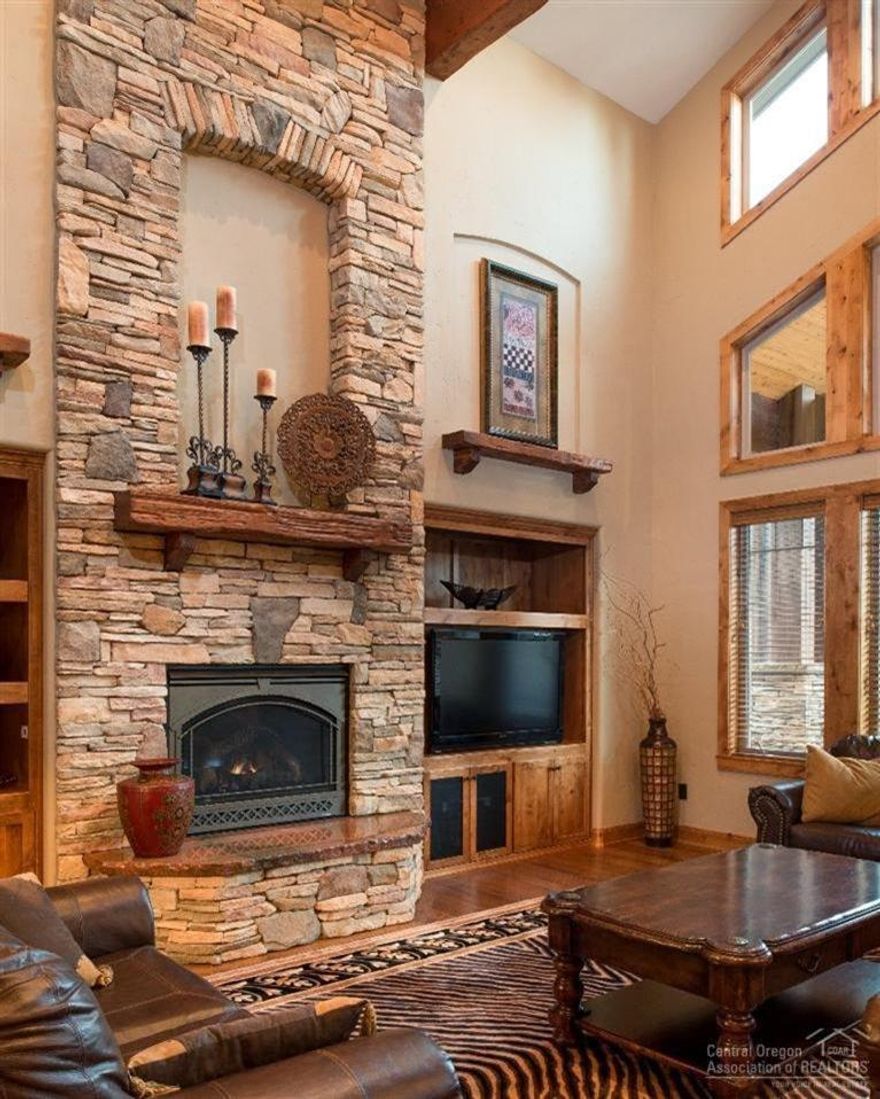 Resort style pampering at this magnificent home boasting 4 suites, vaulted beamed ceilings and the sought after great room floor plan. High-end custom finishes throughout w/ surprising extras & special touches around every corner. A custom gourmet kitchen featuring stainless steel appliances & eating bar. This home has a bonus media room & wet bar area. Enjoy looking out to the 4th Fairway of Woodlands Golf Course from your large deck w/ covered area & hot tub. Triple car garage.