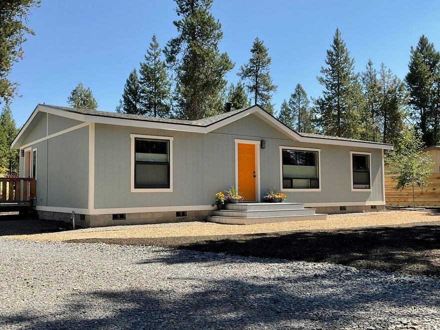 Price includes $10,000 seller credit for buyer closing costs. Refreshed oasis with National Forest and Big Deschutes River access a block away. Located in a lovely community with a private marina, five deeded river access easements and exceptional quality community water. Clean, modern and low maintenance after extensive renovation the past two years. Upgrades - new roof, xeriscaping, expansive composite deck, floor to ceiling custom tile in baths, Milgard windows, interior and exterior paint, flooring, water heater, all appliances, full kitchen remodel and much more. Owner has meticulous records for all upgrades and materials. Fenced with local timber, fully enclosing the .52-acre lot creating a private & peaceful sanctuary. Plenty of space to park your RV, boat, and trailer as well as a wood shed, carport and 30-foot storage container. In Central Oregon's recreational empire with abundant wildlife and trails, and a short drive to the amenities of Sunriver and Mt. Bachelor resorts