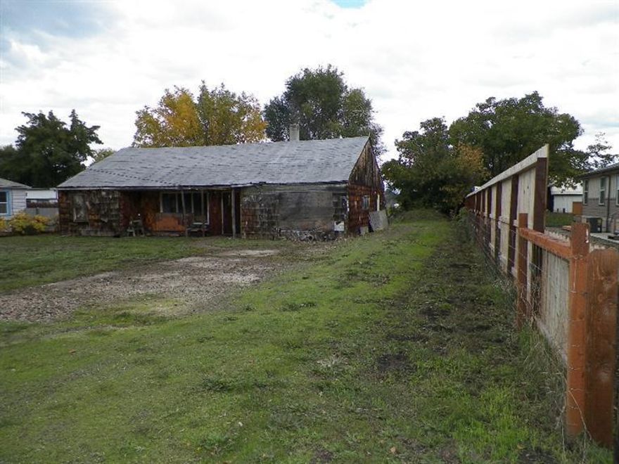 Home site on .41 acres in desirable Jacksonville School District in a family friendly neighborhood backed up to organic farmland. Property has 2 wells, 1 for irrigation and well to house has new well pump tested at 10 gpm. Property located outside of city limits between Medford & Jacksonville. House is currently not livable. Interior wood floors from Old Medford High School gym. Value is in the property which has lots of potential to rebuild the home of your dreams!