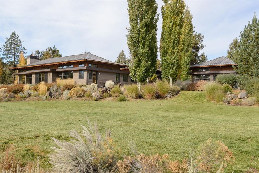 Gorgeous contemporary single level home on a 40 acre wildlife sanctuary and borders National land. Award winning Al Tozer design combines function and beauty and mingles the indoor and outdoor spaces. Radiant heat flooring is cozy and efficient. Open design gives just enough separation of spaces. Master boasts a fireplace, floor to ceiling windows and a spa like bath. Beautiful outdoor living areas and special places scattered around the property. Separate suite, powder bath attached to 2 car garage.