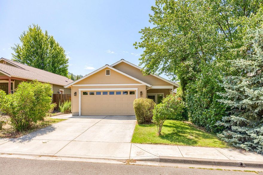 Well-kept home with a great location just a short distance to beautiful downtown Ashland and within the sought-after Helman Elementary School zone. Three bedrooms, two bathrooms with approx. 1450 SF. Oak flooring throughout the living room, kitchen and dining areas. Spacious kitchen with center island, built-in desk and newer appliances. A couple stair treads from the kitchen/ dining area to the living room provide an open floor plan, yet with a sense of separation. Low maintenance side yard patio area and backyard are fully fenced in and are a blank slate awaiting the next owner's creative touch. Attached garage and off-street parking. Wonderful neighborhood to call home, a mixture of newer and older homes within a mile radius of Ashland's jewel, Lithia Park, and the Ashland Dog Park. Welcome Home!