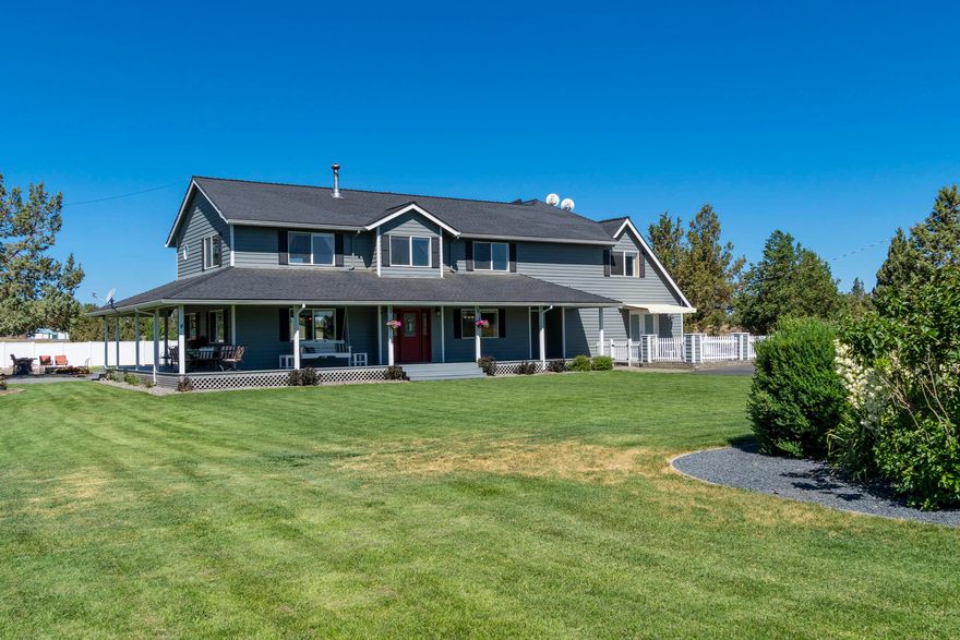 Enjoy this multi-generational country home that has something for everyone!  At 3,964 sq feet, this farmhouse is divided into 3 potential and distinct living spaces.  The main house hosts two master suites (one is currently designed as a self-contained studio apartment), a large multi-purpose room for homeschooling and family game time, and a bonus loft perfect for a work-from-home office.   The additional two BR mother-in-law suite/Airbnb vacation rental offers a full kitchen, full BA, W/D, private entrance, and amazing views of the Cascade Range. This seven- acre property boasts a fully landscaped park-like setting, including 5 acres of automated underground irrigation.  Oversized double 2-car garages, large workshop, and RV/Pole Barn guarantee extensive storage for you and your extended family and all their toys.  Finish your day with a glass of wine on either the wrap-around porch or the upstairs deck while you bask in the high desert sunsets. Welcome home!
