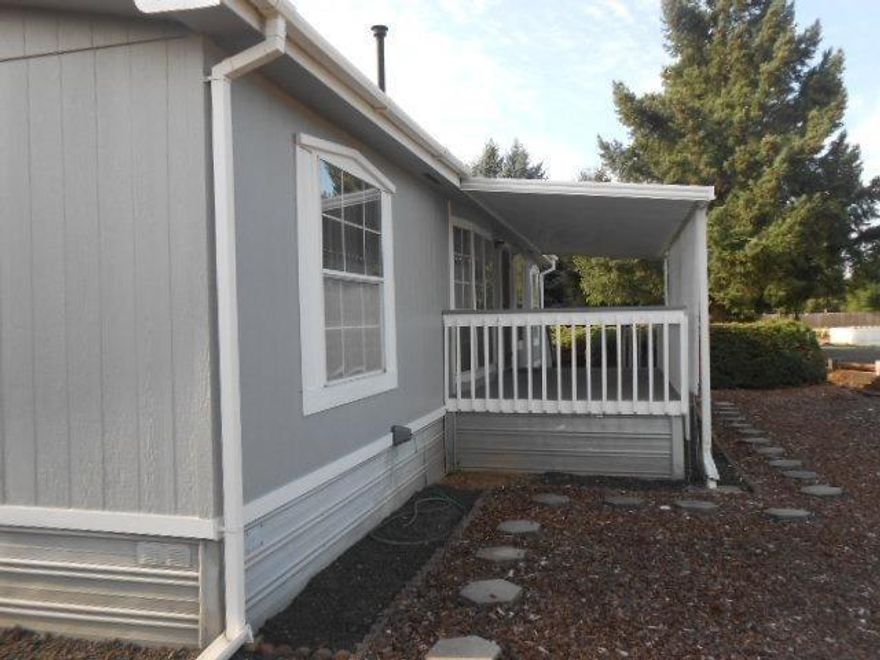 Enjoy this affordable home in the quiet Covered Bridge 55+ Park. Located a block from both convenience shopping and gas, this lovely park has one of the lower space rents around! Home has a solid floor plan with dining and kitchen open to living area. 3 bdrms 2 large baths. Pellet stove for extra heat. Outside expand your living space onto the large covered deck that offers privacy, and a nice lawn area with shade trees, that also provide privacy. Accepted offer includes $3500 credit to help you improve as you wish. At this lower price schedule your viewing today- ask for the amenities sheet so you have full info!