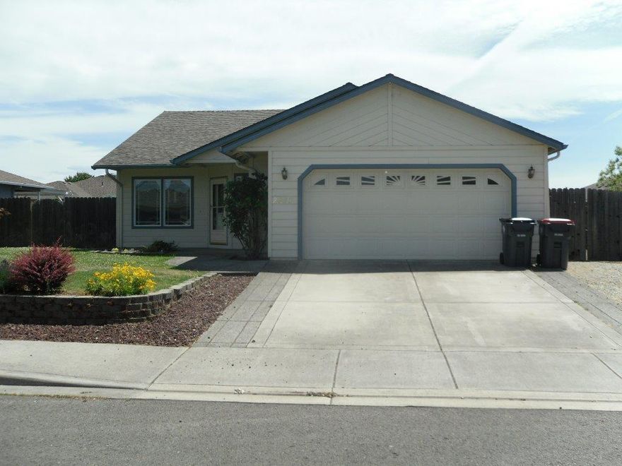 Single level home with RV parking, open kitchen, gas fireplace, garden beds, vaulted ceiling in living room and master bedroom. This is priced to sell!