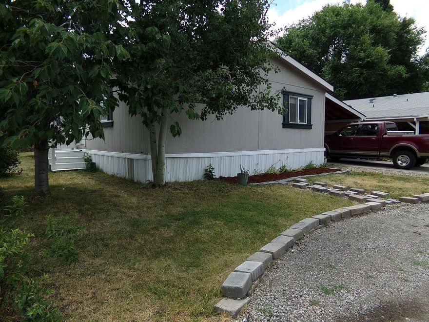 This Manufactured home is in super clean and tidy condition! Great floor plan, with 3 bedrooms with walk-in closets and 2 bathrooms. Second bathroom is off of the Main Bedroom and has a large soaking tub with lots of storage! Large open living room, dining room - kitchen combination with kitchen island, vaulted ceilings too! Covered carport parking and a 13x10 storage shed. Ready for new owners to move right in!! Park rent includes water & sewer. Please see Park Manager for Park approval prior to all offers.