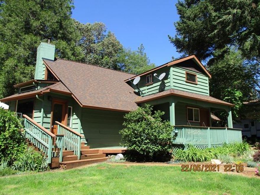 Need room to spread out? This 2.17 level acres located just minutes to town has many possibilities. Nicely updated home with wrap around deck, 3 year old roof and exterior paint features 3 bedrooms, 2 baths, 1916 sf, vaulted ceilings with picturesque windows, certified wood stove, kitchen with island and tile flooring, dining area, hand scraped hickory hardwood floors throughout, laundry room, loft area and office space.  2 barns currently used for storage, 15'x 14'work shop, art studio or playhouse, 27' x 36' RV or boat covered parking, chicken coops, koi pond, 22' x 23' 2 car detached garage and wrap around deck are a few of the outside features. Towering pines, apple, peach and plum trees along with beautiful flowering shrubs surround the grounds. Completely fenced and gated.  Property includes 2 way access, from Sugar Pine or Verde.  Plenty of room for an additional dwelling and would make a fantastic horse property.