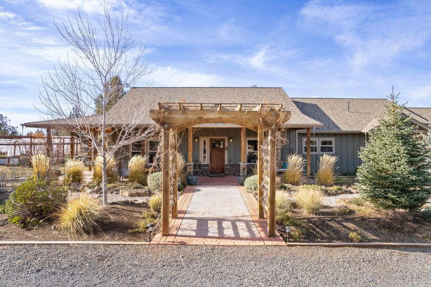 This stunning home is located just East of Bend and sits on almost 15 private acres. Adjacent to 320 acres of Parks and Rec open space and Cascade Mountain views from all around the property, as well as a seasonal irrigation canal that runs through the property creating a riparian zone. The home is a meticulously constructed and cared for 3405 sq ft, 3 bedroom, 2.5 bath. The open floor plan is single level living, with vaulted ceilings and an amazing sun room off the Primary bedroom. The finished basement and extra storage area (250 sq ft) create a great space for a bonus room. The home has solar, a solar net meter and was constructed to be energy efficient in all seasons. Attached 3 car garage and 1800 sq ft well-insulated shop that features 3 work spaces, 200 amp service, and a full bath, assure you will have room for everything. The grounds surrounding the home are abundant with wildflower meadows, deer fenced- raised bed gardens, a greenhouse, water feature, and so much more.
