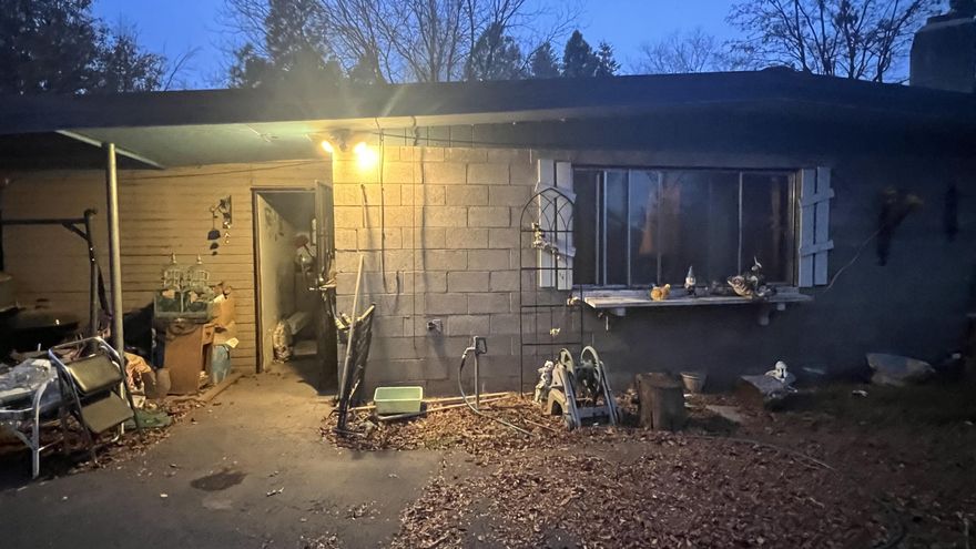 This property and home needs a lot of TLC, but it has a huge shop, hay barn, over 3 acres with irrigation rights and a 2 bed home with an attached 1 bedroom separate living quarters in the rear of the home. This house is a great setup for a mother's quarters, out of town family or  fix it up for an AIR BNB. Back house has new carpet, paint and updated bathroom. Lots of possibilities!! The property has large pine trees, residential well and a 1200 sq ft shop with 3 roll up doors. Bring this property back to its glory.