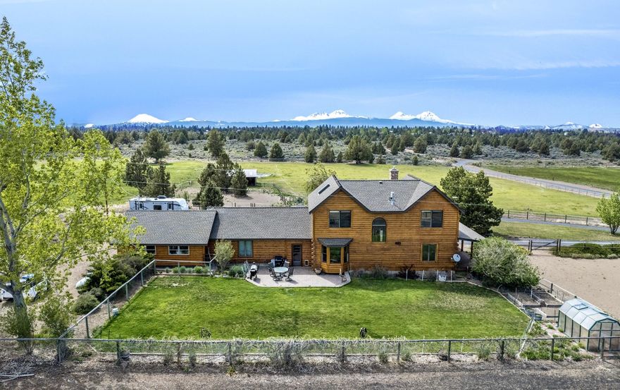 Welcome home to 5.53 acres of spectacular Cascade Mountain view privacy, just minutes to town & amenities! Watch the wildlife & sunsets from your covered front porch and take in the huge Cascade views across green pastures from indoors or out. Ride your horses or walk from home to almost 200 acres of public land & trails bordering west property line. Artisan hewn timber squareD construction with finished drywall interior are combined to create this peaceful NW retreat. The home features plenty of light and additional spaces include formal dining and family room or flex space in addition to 4 bedrooms. And also DETACHED large vaulted GUEST QUARTERS or STUDIO with half bath! This property is perfect for horses/animals with 3 stall barn (with power), 3 ac. irrigation w/ pond, fenced & cross-fenced. RV parking & dump. Newer 1500 gal septic for future additions. Irrigation pump & equipment included in sale. Newer high end Pella wood-clad windows. Ductless heat/AC in Guest Quarters.