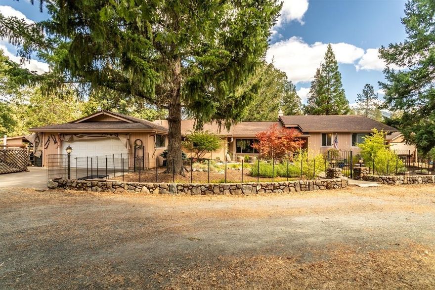 Home on the Range. 5 level, fenced acres, with a spacious ranch style Home with Shop and RV parking! The home features vaulted wood beam ceiling Living room, Kitchen with large picture window, solid surface counters with farm style sink, propane cook top, wall oven and microwave, a Dining room large enough for every gathering. The Master Suite is very spacious, has 2 closets, glass doors to the patio, and a beautifully remodeled master bath with walk in tile shower, and double sinks. There is another bedroom, full bathroom, Laundry Room large enough to have a big freezer, and half bath. An attached hobby type room is not included in the square footage and attached 2 car garage with extra tool storage area. Set back off the road, the property is a beautiful blend of open space and trees, it has a circle driveway, dedicated RV parking with hookups, 24x36 shop building, fencing with gates for access to the pasture areas and a great location.