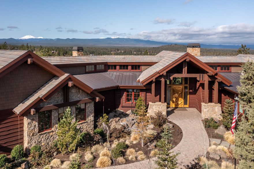 With the breathtaking Three Sisters Peaks, Mt Bachelor & Mt Jefferson, North Rim is the crown jewel of Bend's west side. This amazing custom home, perfectly positioned on one acre, lives all on one level. And it has a 6-car garage for all of your Central Oregon toys and gear! You enter the Great Room featuring a massive stone fireplace and outstanding views, exposed beams & wood ceilings. A home built for entertaining family and friends, with an open professional kitchen, ultimate wet bar, indoor/outdoor room with retractable doors, and a blazing fireplace. Wide plank White Oak floors throughout, a state-of-the-art Theatre Room, Office, Wine Cellar, Dual Primary Suite Baths & Closets. Complete with the North Rim Lodge, Tennis/Pickle Ball court & trail system. This home is a must see!