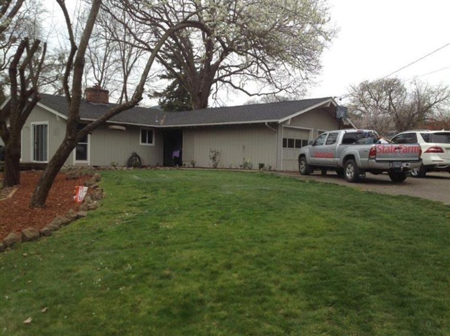 Beautiful Griffin Creek Area. This home has 4 bedrooms, 2 full baths and is situated on .55 of an acre. Griffin Creek borders one side of this property with Talent irrigation. Substantial upgrades throughout. Kitchen has new paint, hardware, sink, Stainless Range/Oven and dishwasher, carpet, light fixtures, new interior paint, custom blinds and new interior doors, both bathrooms completely updated with custom cabinets, tile, and granite. Large family room with certified wood stove insert. Large front yard, in ground sprinklers. And much more. Close to Griffin Creek Elementary.