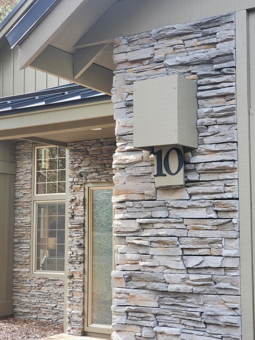 Tucked away in the quiet NW corner of the resort, this High Cascade craftsman design is a timeless look that epitomizes the Sunriver style. Steep pitched metal roof, stacked stone accents, two-story vaulted Great Room with open truss design and more. The Primary Suite is on the main floor in addition to a 1/2 bath. The kitchen with breakfast bar and gas range flows beautifully into the Great Room. Cozy up in front of the gas fireplace to enjoy a good book. The composite deck spills out from the dining area and overlooks a nice common area. Attention to detail throughout with wood wrapped windows and solid panel doors. Even the stiles on the stairway have a craftsman touch. Upstairs, you'll find two very comfortably sized Guest Rooms, a full bath and extra storage. This has been a family home for the last 10 years and not in a rental program. Imagine the memories made here and those yet to come! Call today for a private showing.