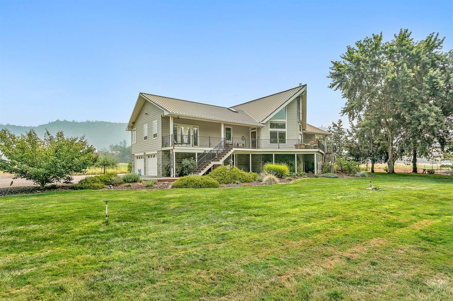 Located on the famous ''Rattlesnake Rapids.'' 700-Feet of Rogue River frontage. Enter through a gated entry to this beautiful 2-story home with basement built in 2001 on 10.22-acres on two tax lots with irrigated pasture. Home features 3-bedrooms, 3-bathrooms, solid oak floors, high vaulted ceiling, gas fireplace, kitchen island, eating area, large pantry, built-in desk, formal dining area with coffered ceiling, central vac, wet bar with refrigerator, built-in book shelves, utility room, master suite with views of the river, jetted garden tub and more! Lots of decking with gas BBQ hook-up. Raised garden beds, apple trees. Finished 3-car garage with shop with built-in shelving and room for a wine cellar; room for RV parking. River rights (domestic with filtration system through UV system). New deck and paint. 36x60-Shop.