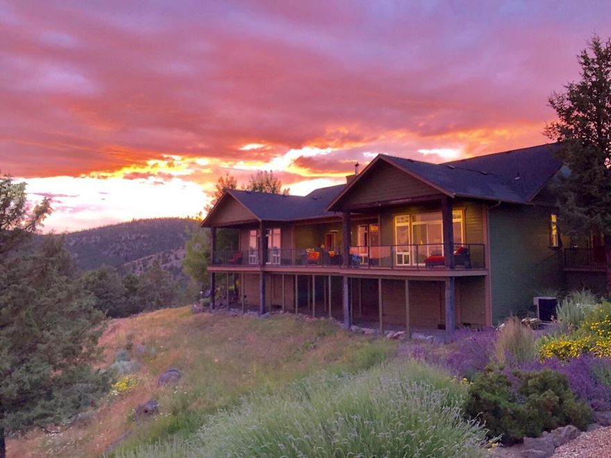 Enjoy your own private nature retreat on this stunning 250 acre property, overlooking McKay Valley!  360-degee views with direct access to 275 ac. BLM!  Beautiful landscaping with storage galore! Spacious 3,434 sq ft single story, custom- built home with quality amenities including open floor plan, and high, vaulted ceilings throughout. Newly remodeled kitchen with stainless steel gas cook top, hood, and marble countertops.  Large, yet tranquil primary suite, plus 2 additional bdrms, 2.5 ba , laundry, office, & 3 car garage!  JOTUL wood burning stove. Sprawling decks with Fire Pit and barbeque plumbed to propane. Suited for multiple outdoor activities from horseback riding and hiking to ATV exploration! Greenhouse and beautifully landscaped yard. Over 7,500 sq ft of outbuildings including 4 Stall Barn, Hay Storage and a multi-purpose  Activity Building. Border fenced and cross fenced for horses. Gated drive. All only 8 miles from town! Too many Amenities to list! A 'must see' property!