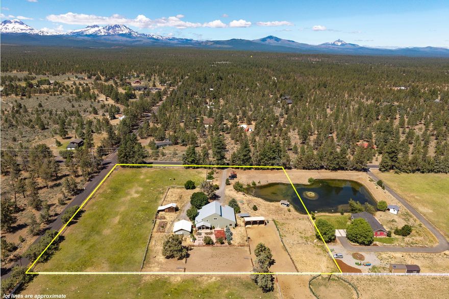 Your personal haven is waiting between Bend and Sisters on 4.58 acres! Fully fenced this property features 2.5 acres of water rights/irrigated pasture! Located on a private corner, you can ride your horse from your pasture straight to miles of national forest trails. The home is positioned for ultimate seclusion & allows you to feel as though you are on private retreat. There is something for everyone with an exceptional 2,200 sq. ft. attached shop that has an RV bay, spacious workshop/hobby room, detached double car garage, hay barn, garden beds & outdoor arena. You will enjoy the outdoors from your front or rear deck, the garden gazebo, or by gazing out over the incredible pond! The home is served by a strong well that pumps 300 gallons of water per minute & highlights a floor plan that maximizes its sq. footage and offers a variety of uses with large rooms on all 3 levels. Located in the respected Sisters school district this property has been well managed, is close to town, & offers great privacy!