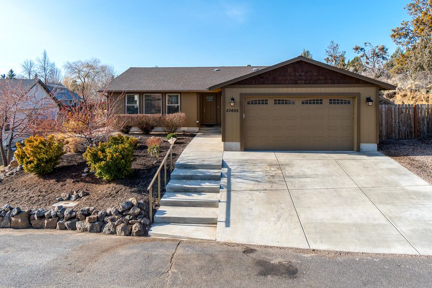 Turn-key home in NE Bend nestled against a lava outcropping in the Vista Ridge subdivision just down the street from Boyd Park. Single level w/Vaulted great room & open floorplan that brings in an abundance of light. Home was completely rebuilt 2 years ago & is like new! Engineered wood look flooring throughout main living areas & bedrooms for a cohesive look & no carpet! Open Kitchen features a lg central island w/breakfast bar seating & granite counter tops & full height backsplash. Modern custom cabinetry w/slow close feature, undercabinet lighting & brushed nickel hardware. Dining area has a french doors that open to the back yard & deck for convenient grilling & entertaining. Primary bedroom is lg enough for a King sized bed w/ a walk-in shower in Primary Bath. Two additional large bedrooms w/ shared bath. Both shower surrounds are solid Quartz! Ductless heating & cooling, the latest efficiencies & a dbl garage & RV space too. Low maint. landscape & move in ready! *SEE OPEN HOUSE