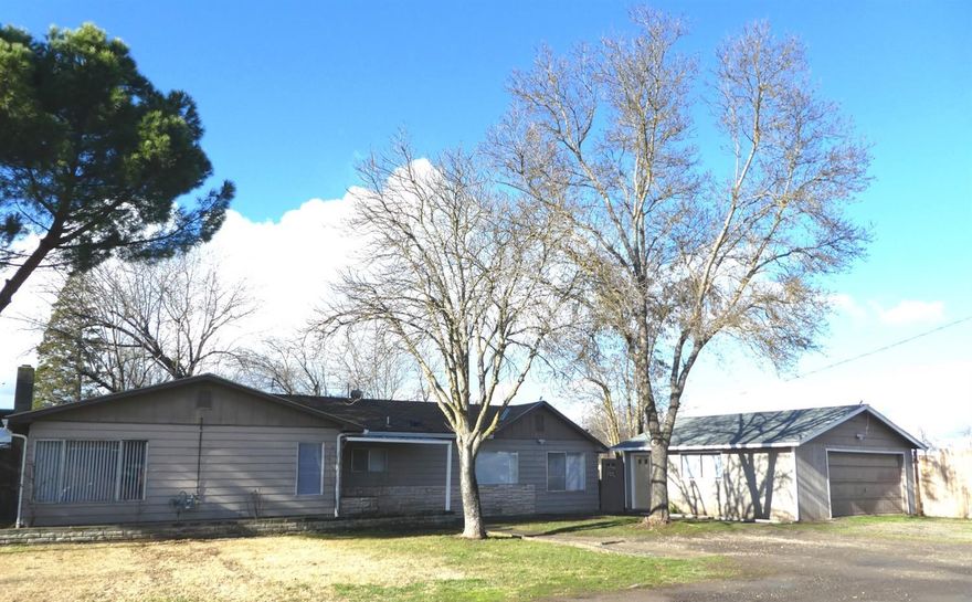 Two stand-alone homes sitting on approx. 1.00 acre in the heart of West Medford. Both single level with a detached oversized 2-car garage on the main residence (1298 Sunset) which is approx. 1778sf with 3-bdrms & 1-bth and additional residence (1298 1/2 Sunset) which is approx. 700sf with 1-bdrm & 1-bath. Main home features new natural gas forced air heat, new laminate floors, new interior paint and recently updated bath with skylight. Additional residence features laminate floors, indoor utilities & some vinyl windows. Both homes offer separate fenced back yards along with additional partially fenced & nicely treed level acreage with seasonal pond and some outbuildings. Current combined rents are approximately $2600 per month. Ideal for extended family or investor opportunity.
