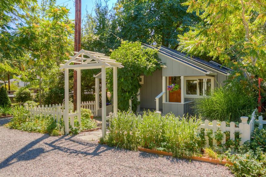 Romantic cottage in a lovely creek side setting in downtown Historic Jacksonville. This charming home has a white picket fence, a covered front porch, a vaulted ceiling and an open floor plan. Windows and skylights provide wonderful light. There are lots of creative storage places and a full size laundry room. The screened in porch overlooks the seasonal creek and there is a spa on a deck adjacent to the screened in porch that is very private. The screened in porch and deck create additional living space to be enjoyed but is not included in the square footage of the house. Mature trees provide shade in the summer. There is attractive low maintenance landscaping and off street parking. All appliances and some furnishings are included in the sale. Historic Core Zoning may allow the uses besides residential. New 30 year roof and exterior paint, property has been used as a vacation rental by a previous owner. Can not be shown until August 27th.