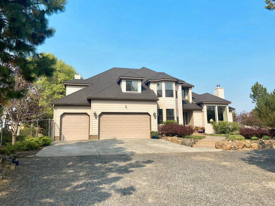 The Cascade Mountain view of your dreams awaits at this close-in 4.76 acre property! Grand entry welcomes you into the formal living and dining rooms where views are sure to please! Huge kitchen overlooks the back deck and mountains, and opens to the large great room. Also downstairs is an office or artist studio with great windows and lots of light. Upstairs you'll find a grand primary suite with even MORE mountain views! Huge ensuite bath and walk-in closet. Pull down stairway in closet leads to usable bonus attic space. A junior suite, 2 more bedrooms and hall bath complete the upstairs space. Outside you'll find both a storage shed and 14'x24' shop with workbench and storage plus roll up door. If you're lucky, the neighborhood owl might fly out of the trees as you walk through the grounds! This home has been lovingly maintained and is ready for new owners - brand new roof, back deck freshly refinished, inspection and minor repairs completed, move-in ready.