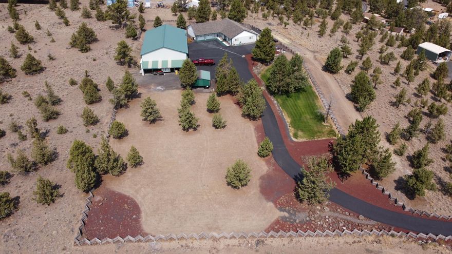 Enjoy the Ochoco Mountain and Prineville Valley views from almost any room of this very well maintained 1650 sf home. There's also a patio off the back of the home where you can soak in the scenery. This 3 bedroom 2 bathroom home is situated on 3.72 acres in the Highlands Subdivision at the end of a quite cul-de-sac. The home also boasts an over sized (992 sf) 2 car garage with plenty of built in storage. In addition to the over sized garage there is a 4 Bay (1 RV Bay Door) 3053 sf partially insulated shop with a half bathroom, loft area and wood stove. The grounds include 1 full RV hookup and 2 additional RV spaces with power only. There's also 12,000 sf of asphalt between the house/garage and shop area with an asphalt driveway from the cul-de-sac. Grab your favorite Real Estate Agent and schedule a viewing today.