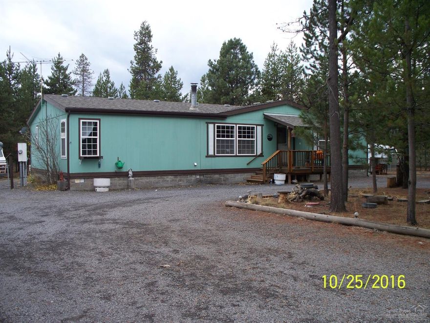 Open floor plan with large bedrooms. Master is separate from other bedrooms. Open kitchen and dining with breakfast bar and pantry. Newer pellet stove. Fenced yard. Has a two car garage with additional storage buildings. Has covered back porch. large closets in all bedrooms.